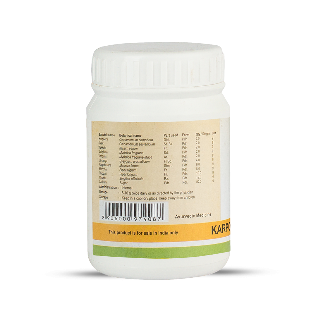 Side view of the Karpooradi Choornam jar, showing a detailed table of ingredients, including Sanskrit name, botanical name, part used, form, and quantity per 100 gm. It also lists administration, dosage, and storage instructions. – Kerala Ayurveda India