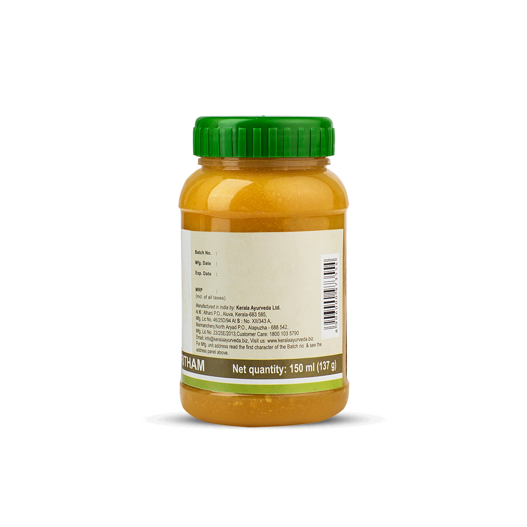 Side view of the Kalyanaka Ghritham jar, showing a detailed list of ingredients, administration instructions, dosage (1-2 teaspoons twice daily for adults), and storage guidelines. – Kerala Ayurveda India