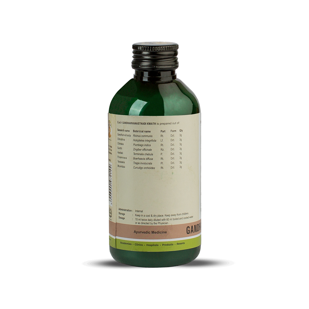 Side view of the dark green glass bottle of Kerala Ayurveda Gandharvahasthadi Kwath, showing a detailed list of ingredients prepared per 15 ml, including botanical names like Ricinus communis and Holoptelea integrifolia. Administration, dosage (15 ml twice daily diluted with 60 ml water), and storage instructions are also visible. – Kerala Ayurveda India