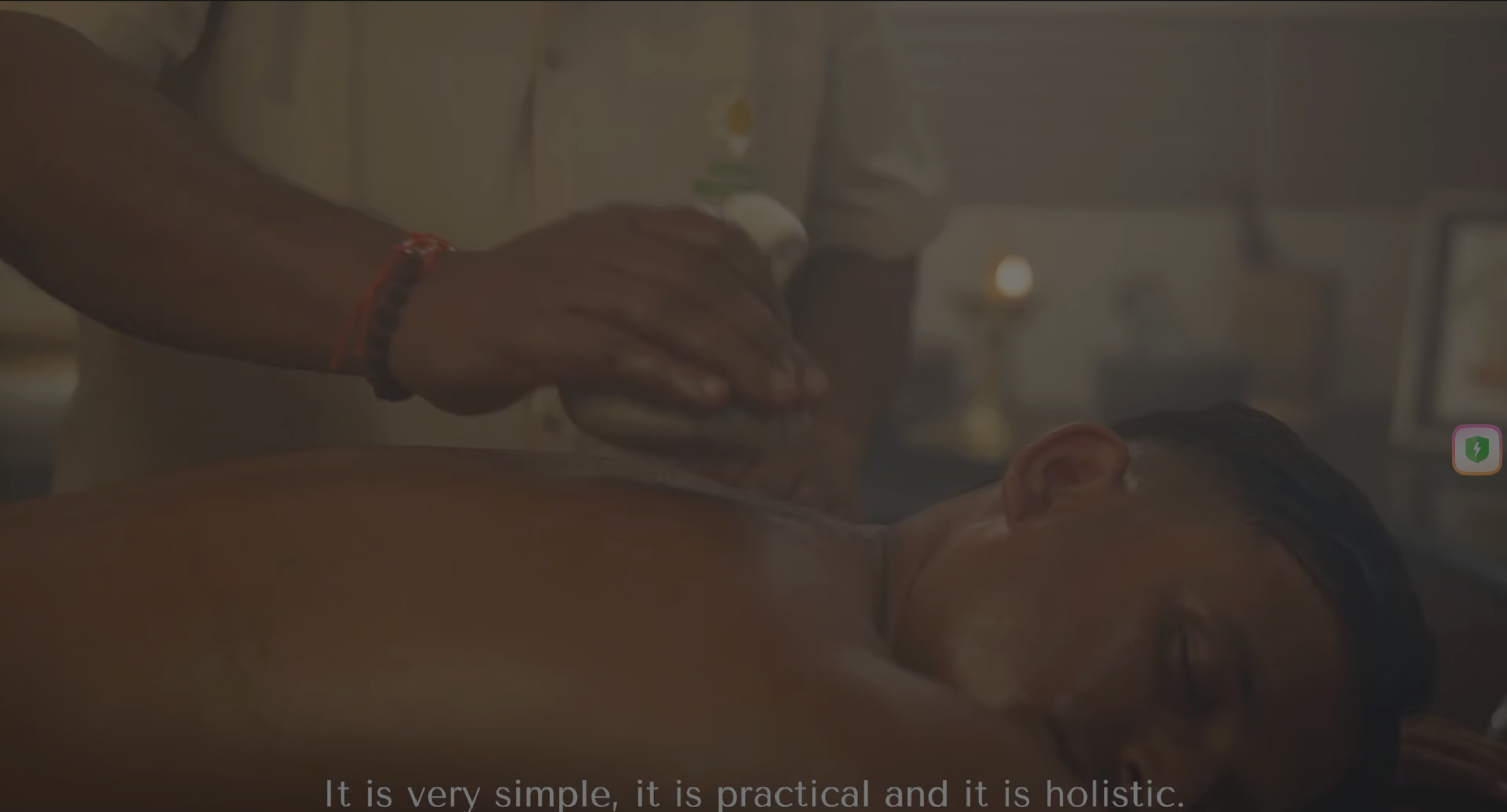 A person receiving a massage while lying on a table in a calming indoor environment.