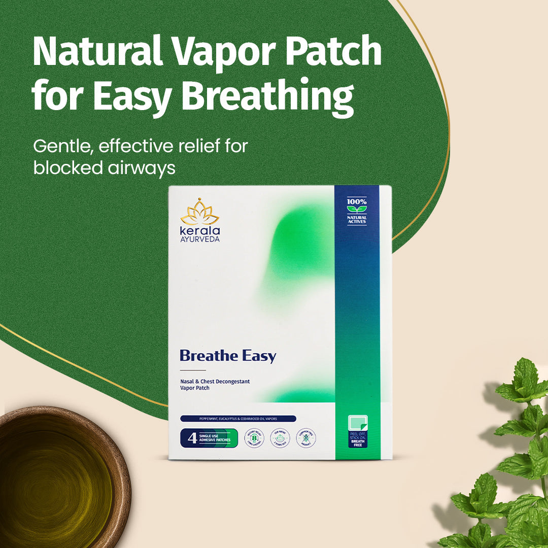 Front view of the Kerala Ayurveda Breathe Easy Vapour Patch packaging, displaying the product name, "Nasal & Chest Decongestant Vapor Patch," and indicating "100% NATURAL ACTIVES." It's shown with mint leaves and a bowl of essential oil. – Kerala Ayurveda India