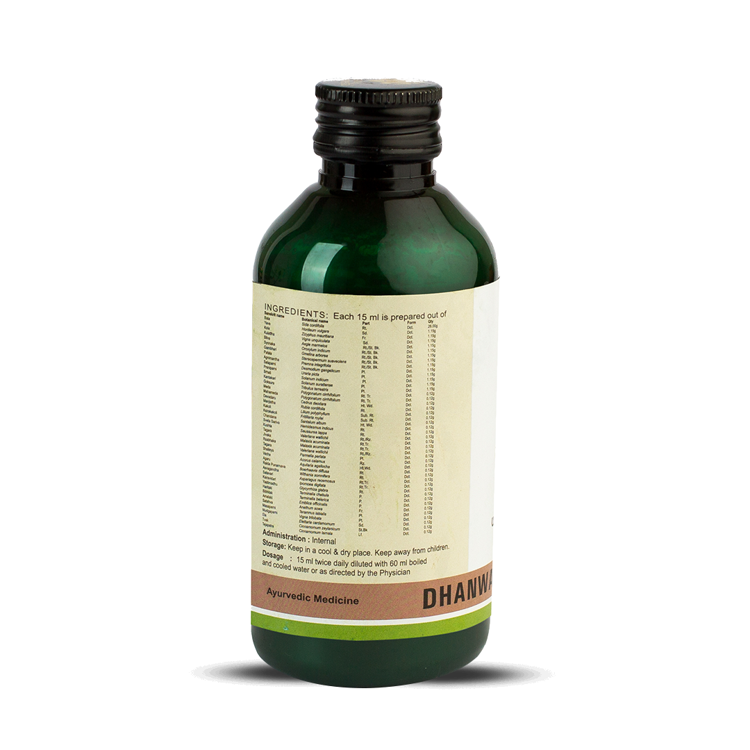 Side view of the dark green glass bottle of Kerala Ayurveda Dhanwantharam Kwath, showing a detailed list of ingredients prepared per 15 ml, and administration, dosage (15 ml twice daily diluted with 60 ml water), and storage instructions. – Kerala Ayurveda India