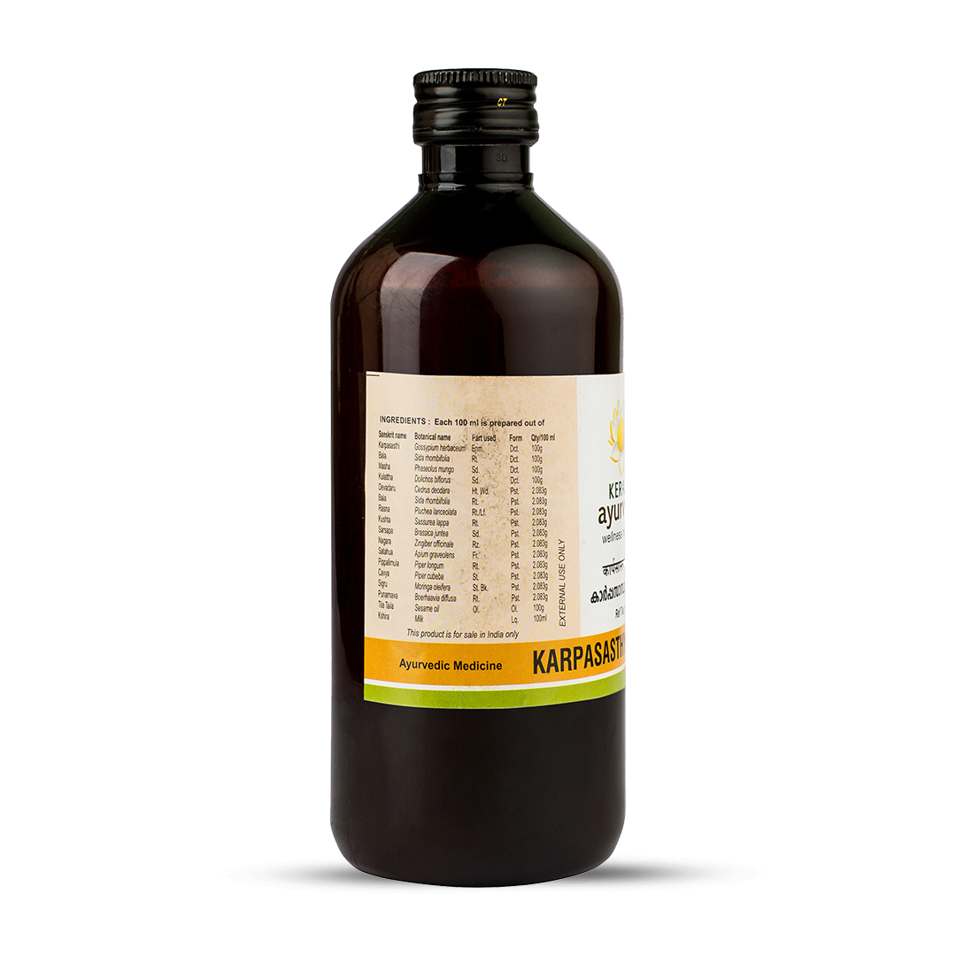 Side view of the dark brown glass bottle of Kerala Ayurveda Karpasasthyadi Thailam, displaying a detailed list of ingredients prepared per 100 ml, and indicating "EXTERNAL USE ONLY". – Kerala Ayurveda India