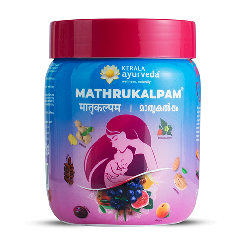 Front view of a blue jar of Kerala Ayurveda Mathrukalpam with a pink lid, featuring an illustration of a mother holding a baby surrounded by various fruits and herbs. The product name is in English and regional scripts. – Kerala Ayurveda India